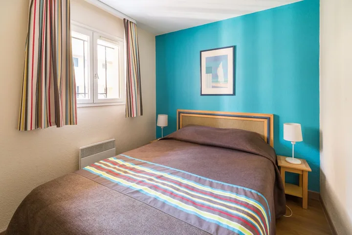 Double bedroom of a two-bedroom apartment at the residence, a quiet room after a late MIPCOM evening